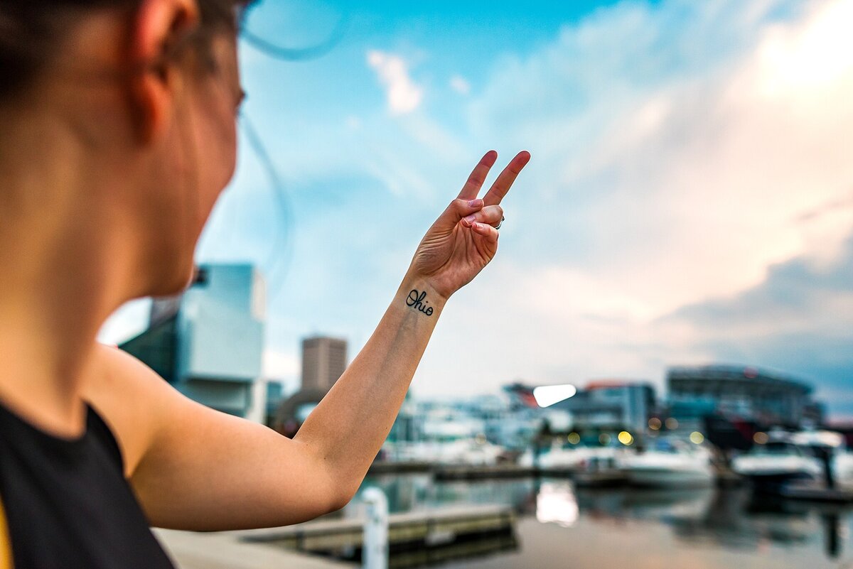 peace sign tattoo city background