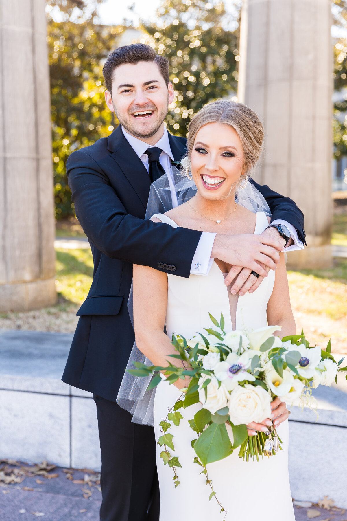 Groom with arms around bride at Tennessee State Museum, Nashville