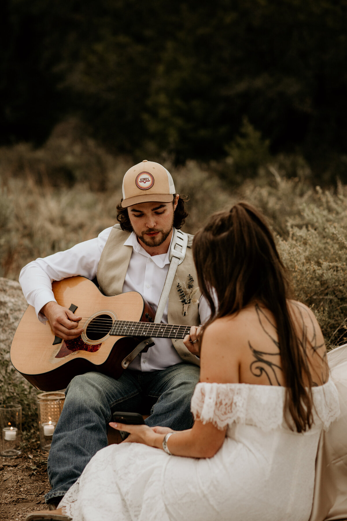 groom singing to new wife and playing guitar at the Albuquerque foothills