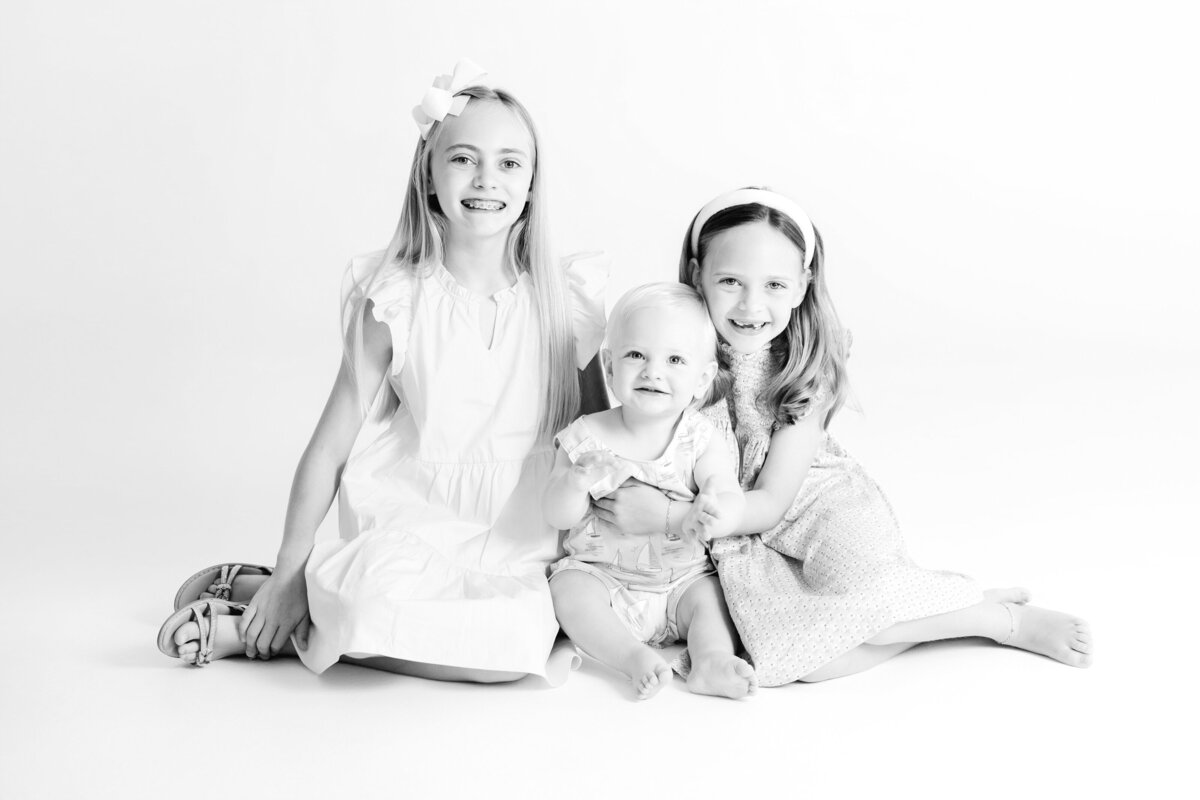 Three siblings in studio session with Caroline Eidson - favorite family photographers Tulsa 