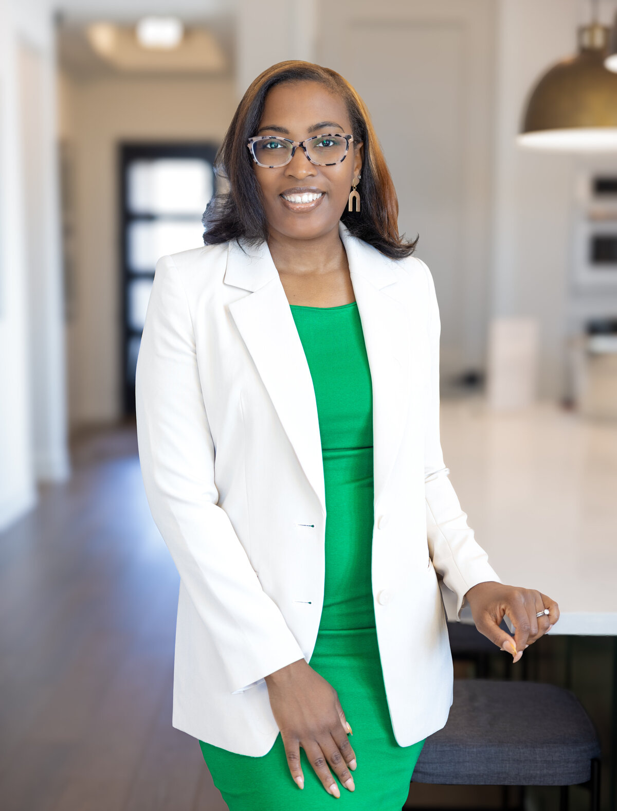 woman having a brand photo shoot in a model home