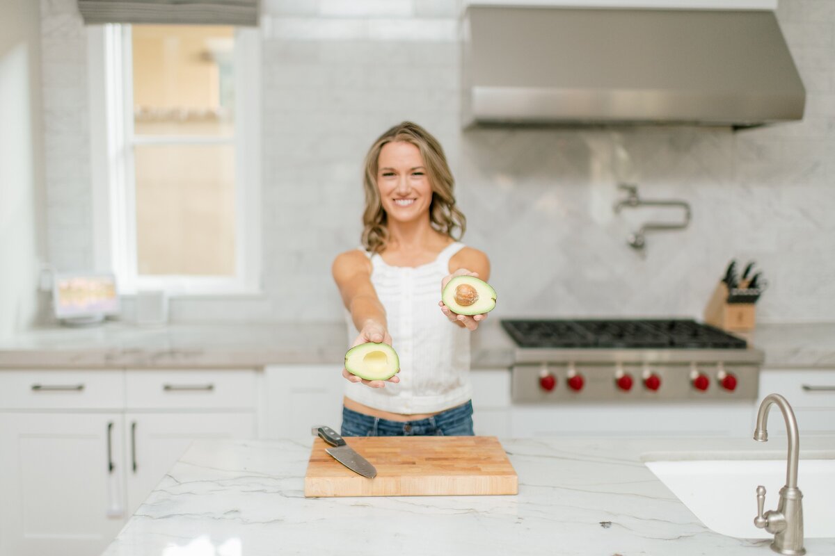 female gut health entrepreneur posing for branding photos  at an in home session in Scottsdale Az