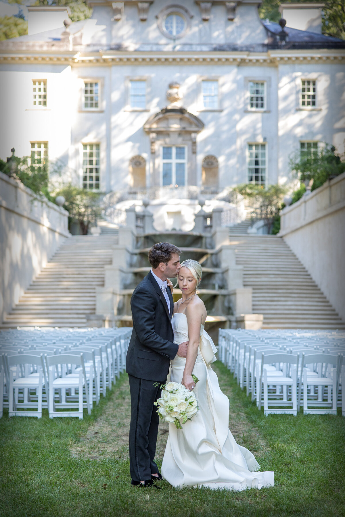 Groom Kisses Bride at Swan House Atlanta Wedding