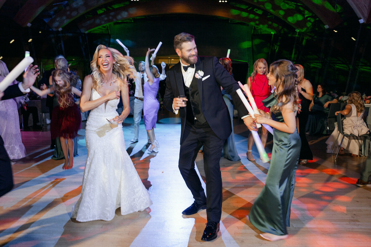 A wedding photo of the bride and groom dancing during their wedding reception at Crystal Bridges Museum of American Art