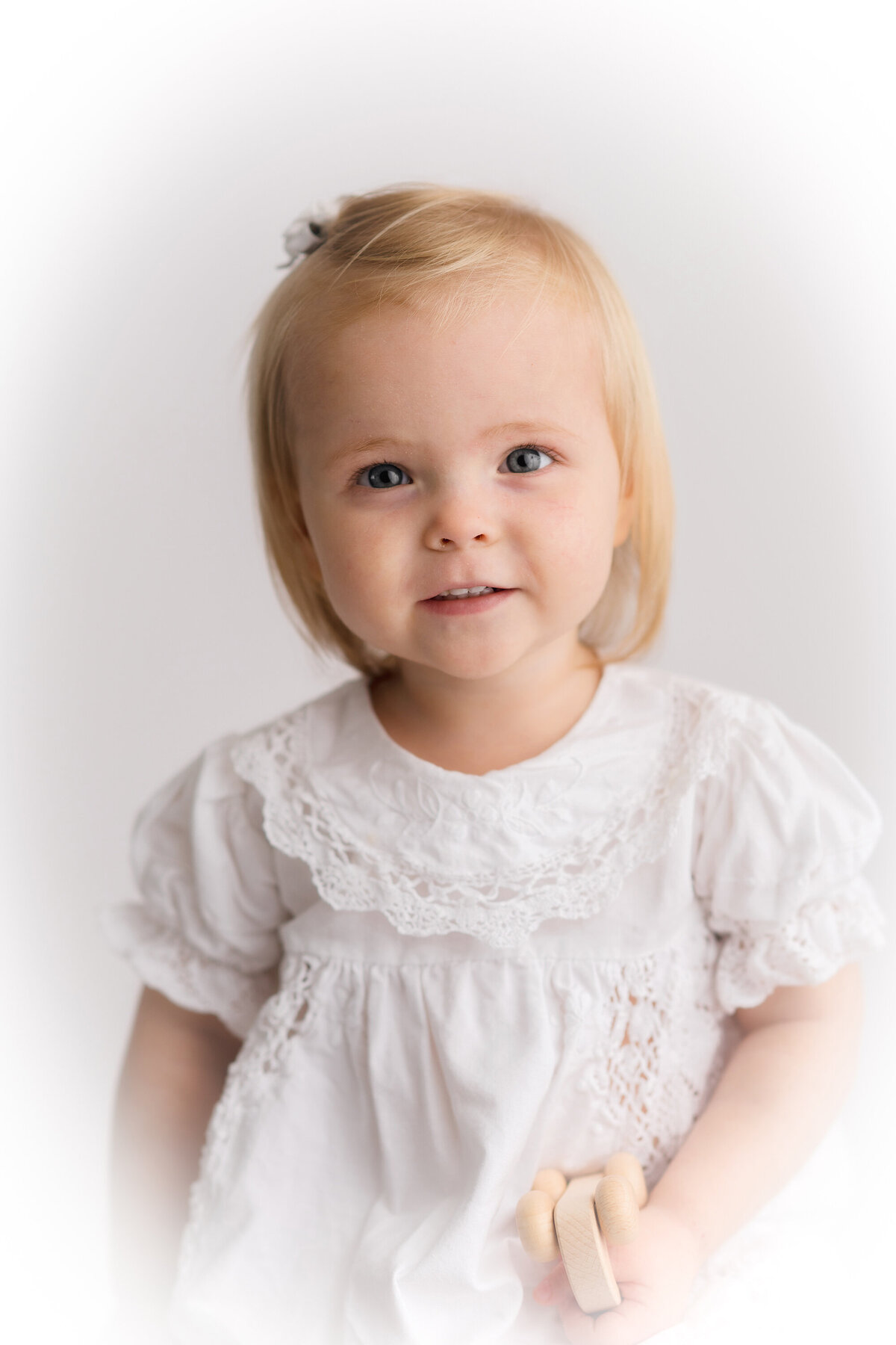 Little girl peers into the camera during Heirloom Photoshoot in Charleston, SC.