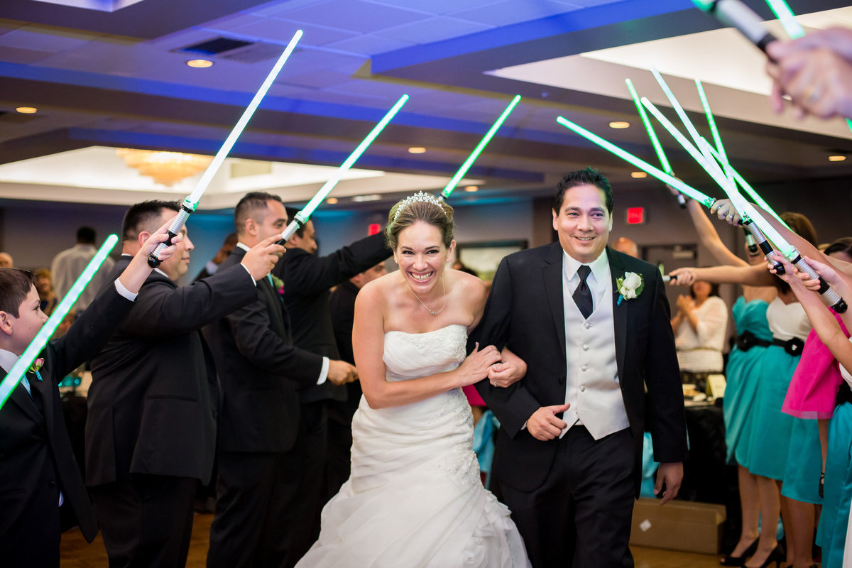 Bride and Groom reception light saber grand exit of star wars themed wedding at Holy Spirit Catholic Church venue