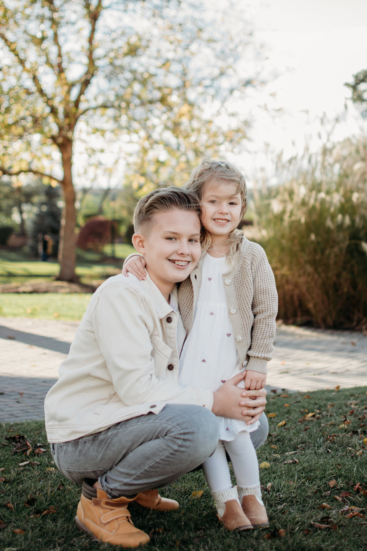 Big brother and sister sharing the love during a photoshoot in Rosemont, IL