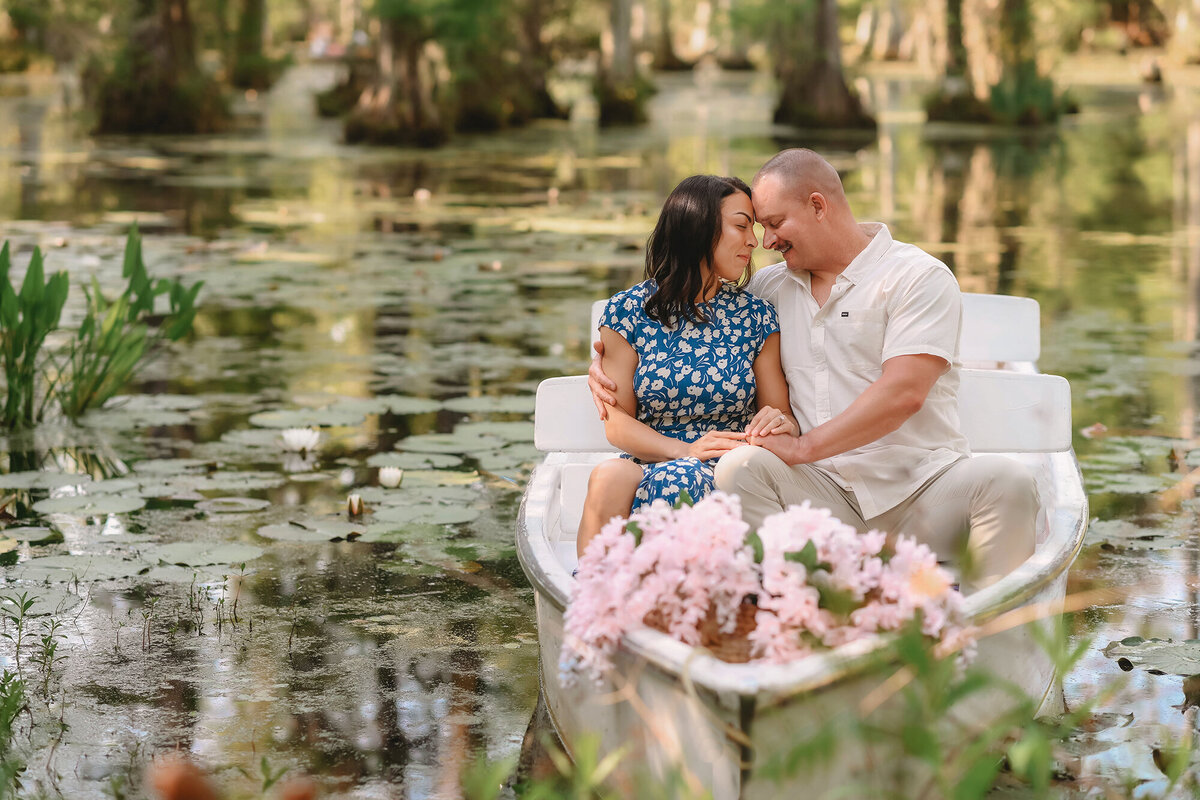 Couple shares a kiss during their Engagement Portraits at Cypress Gardens. 