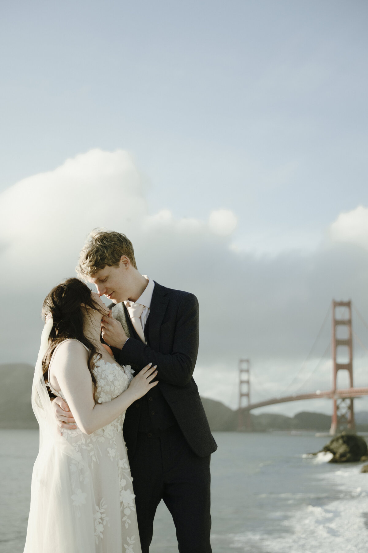 Bride and Groom at Marshall's Beach in San Francisco, California at sunset