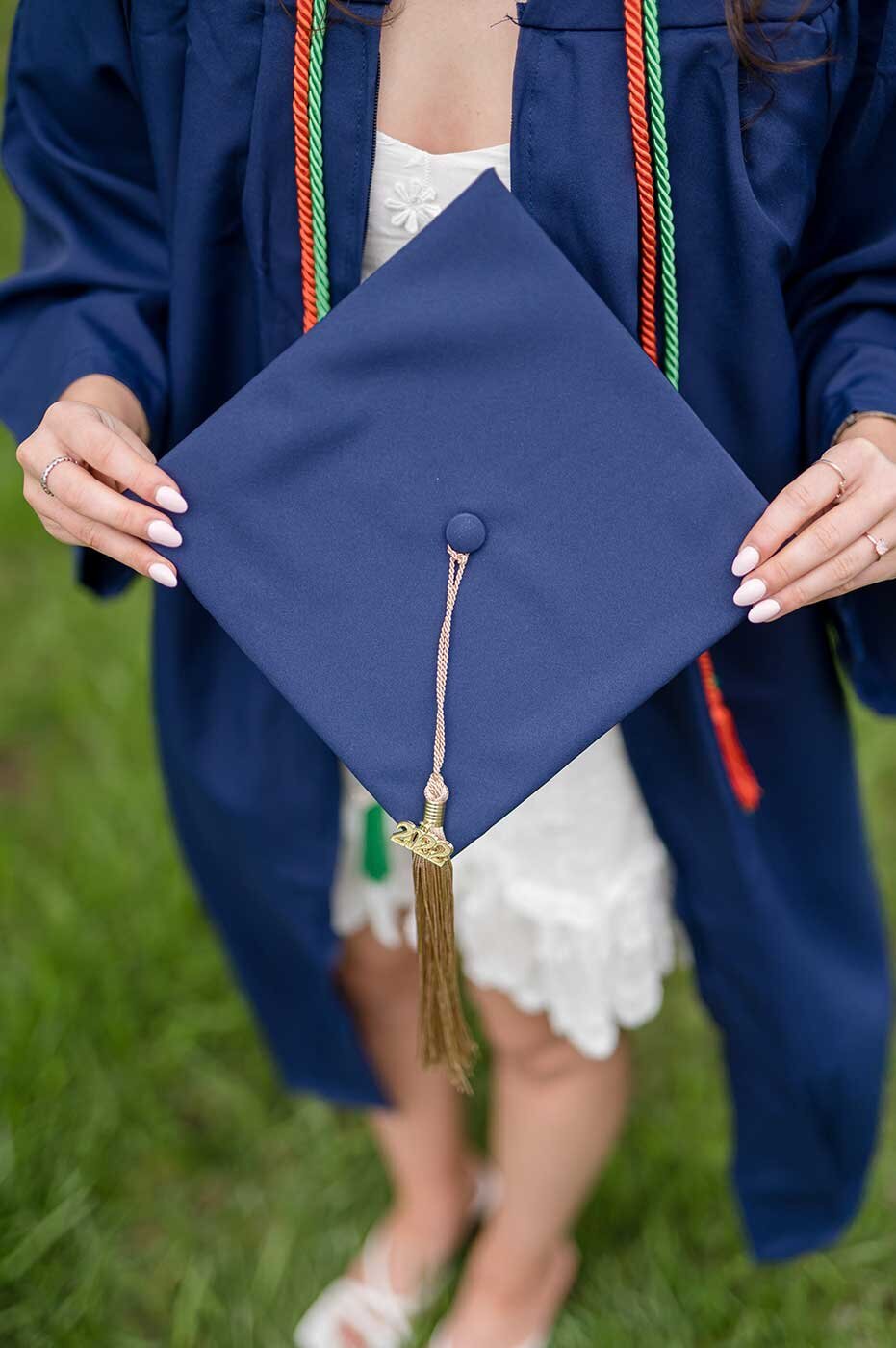 Uconn graduation in cap, gown, and cords