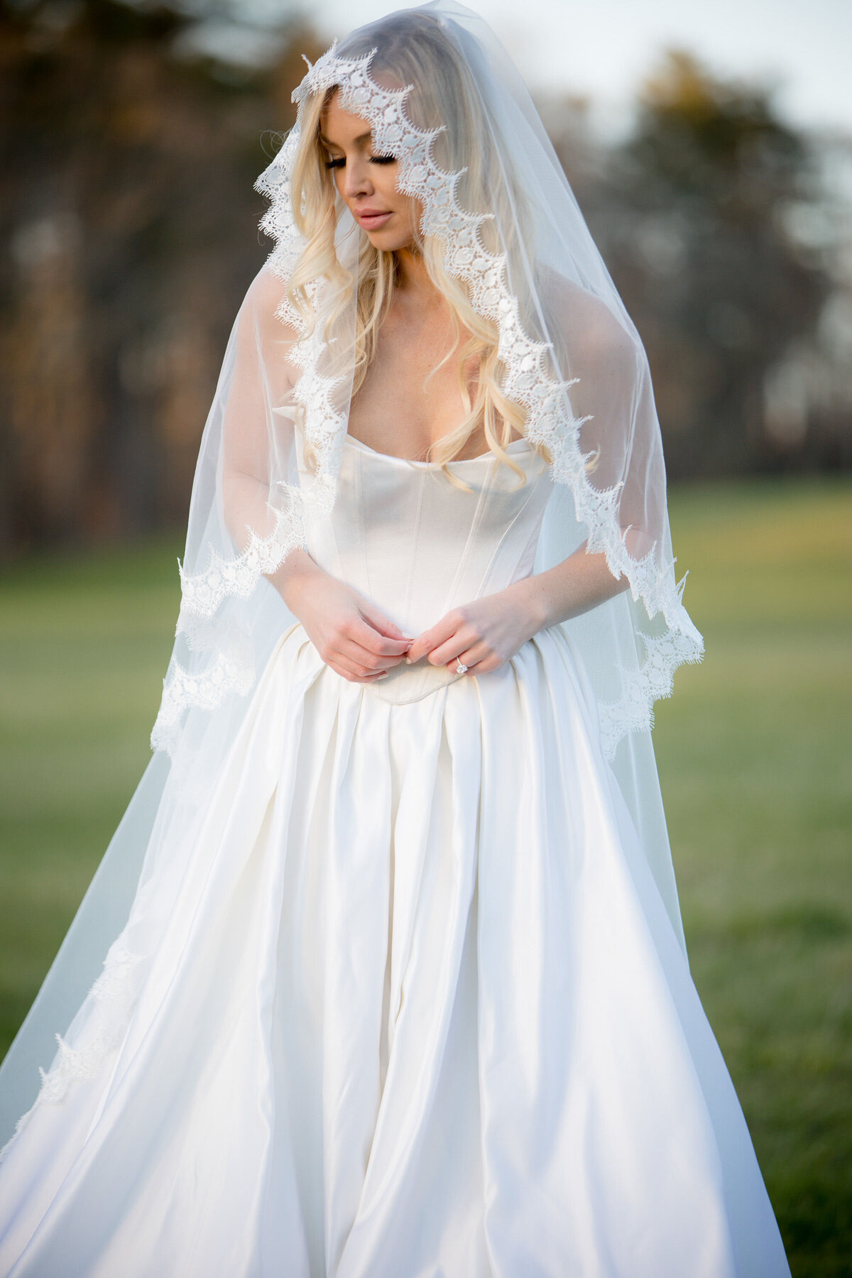 Classic lace mantilla veil styled with elegant bridal gown