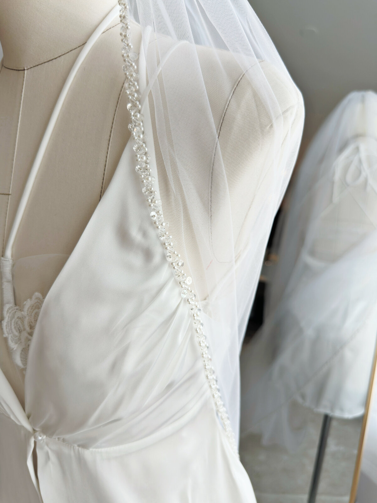 Handmade beaded veil featuring subtle shimmer in sunlight
