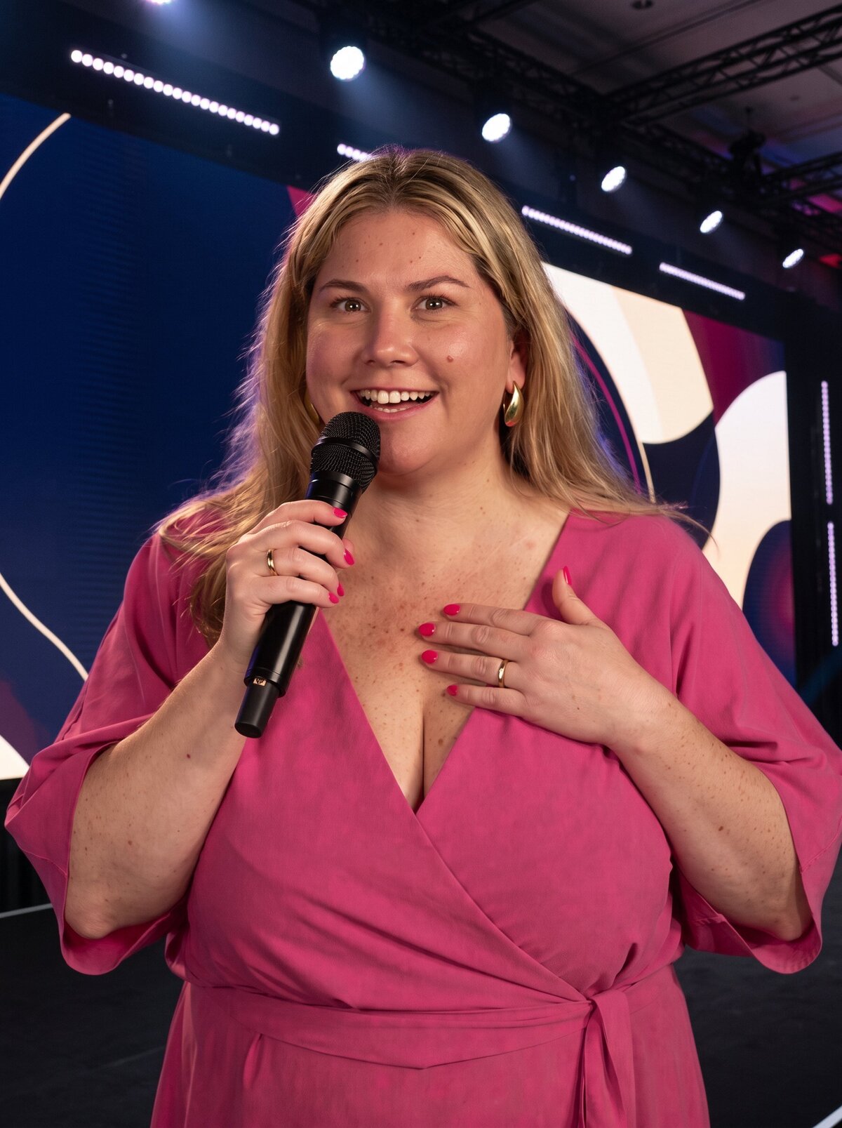 Renee Firth speaking on stage