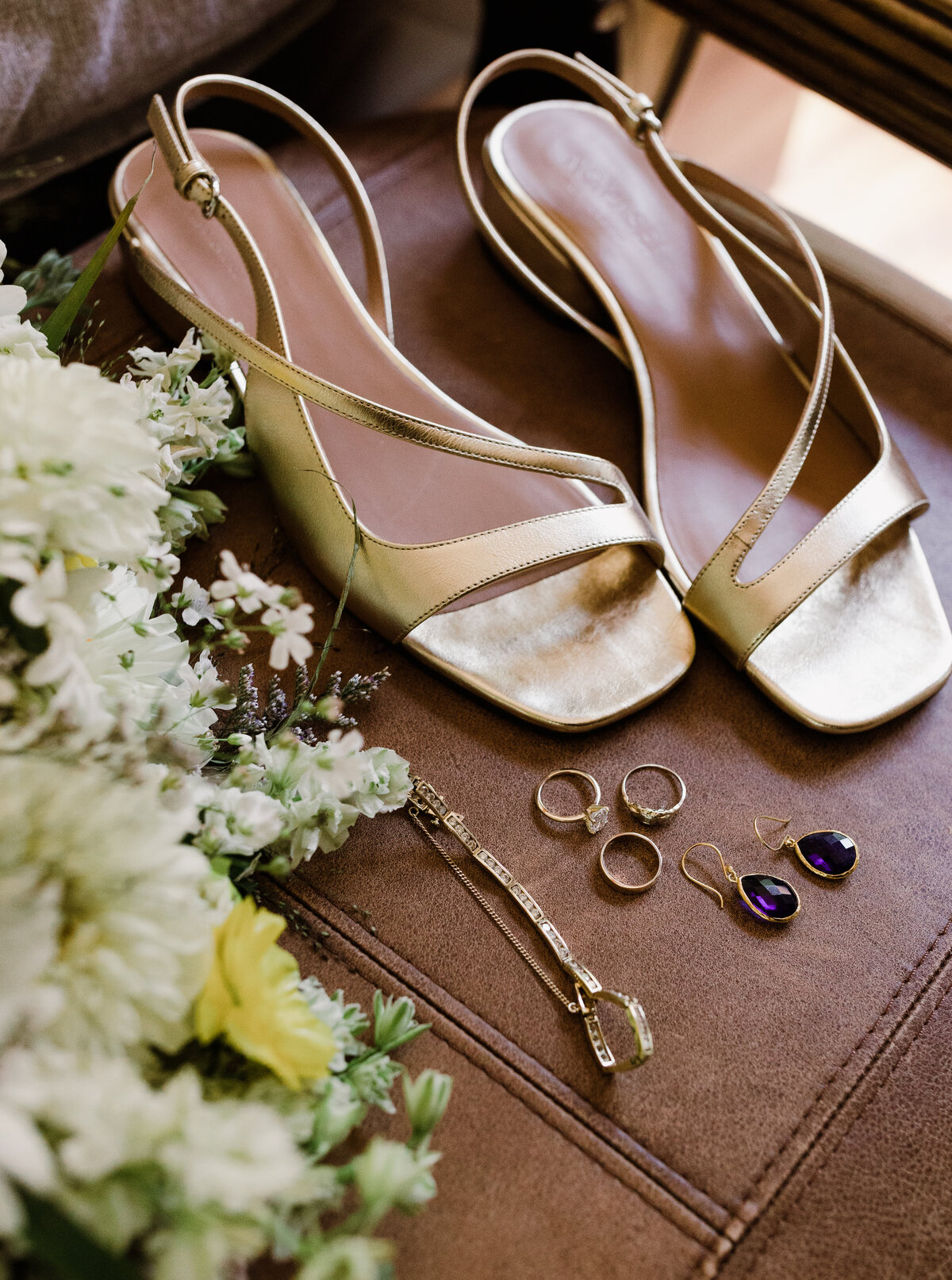 Wedding details including rings, earrings and shoes