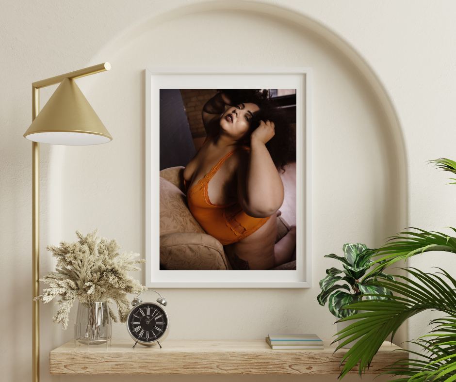 an image of a  woman in orange lingerie  hanging on  the wall from a boudoit studio in Minneapolis MN