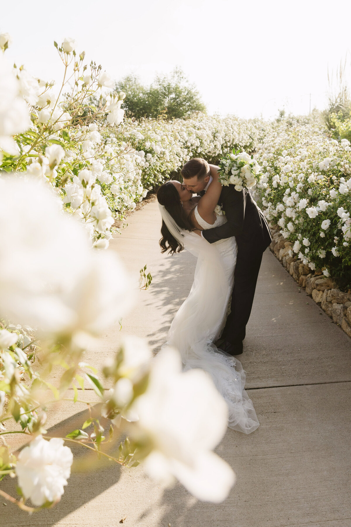bride and groom on  white sand