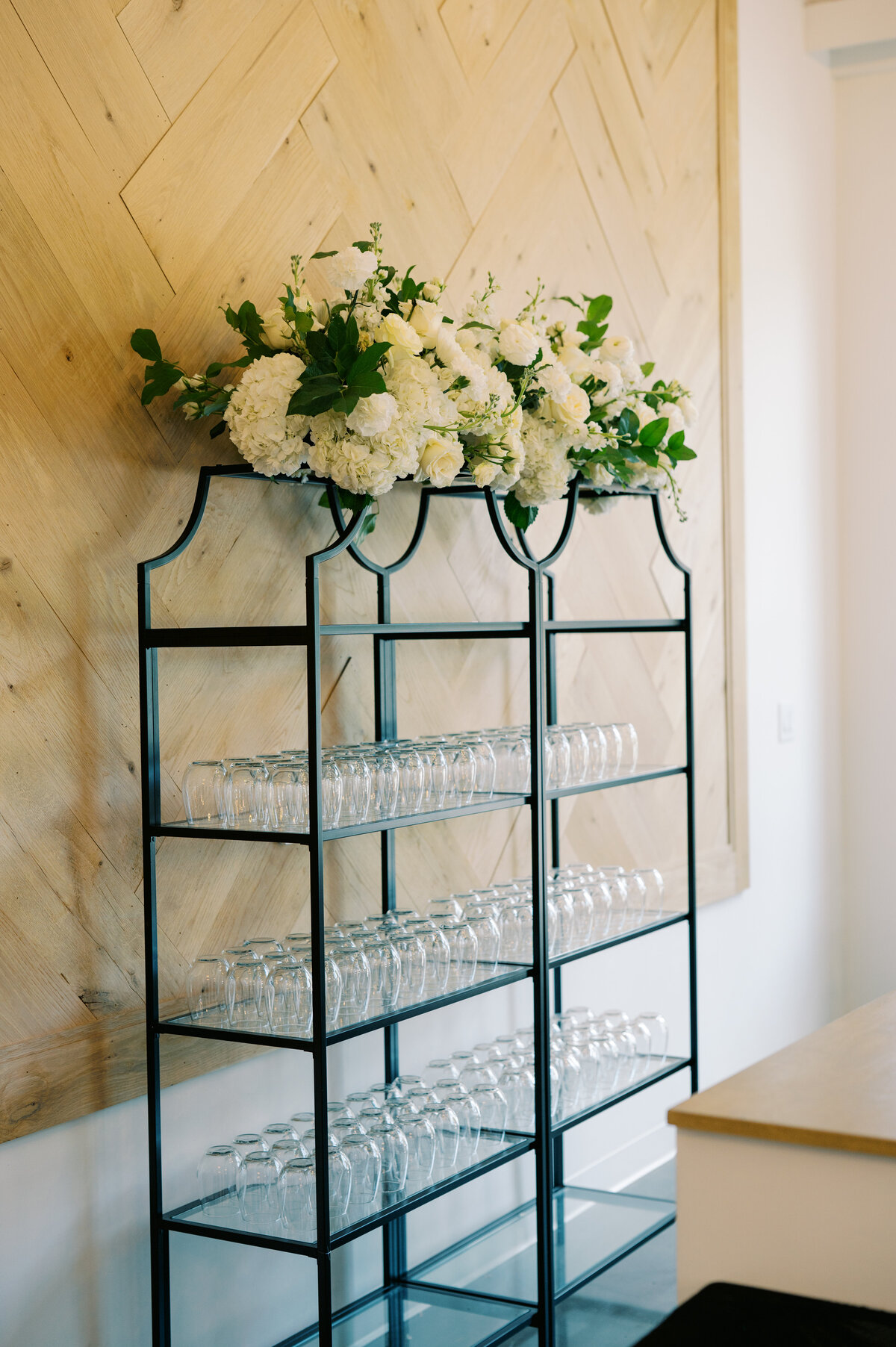 black shelves with flowers