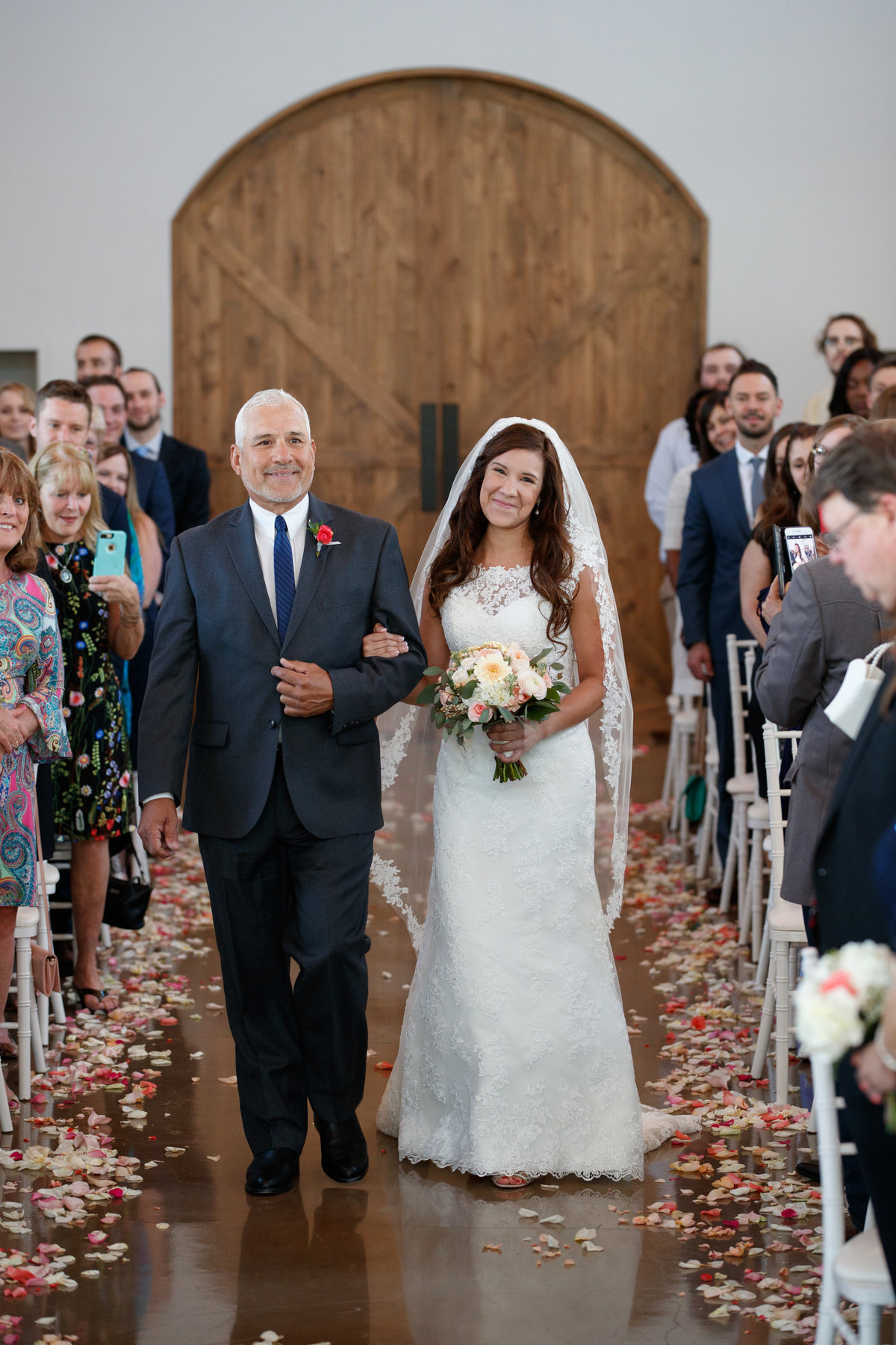 austin wedding photographer canyonwood ridge wedding photographer bride walking down aisle