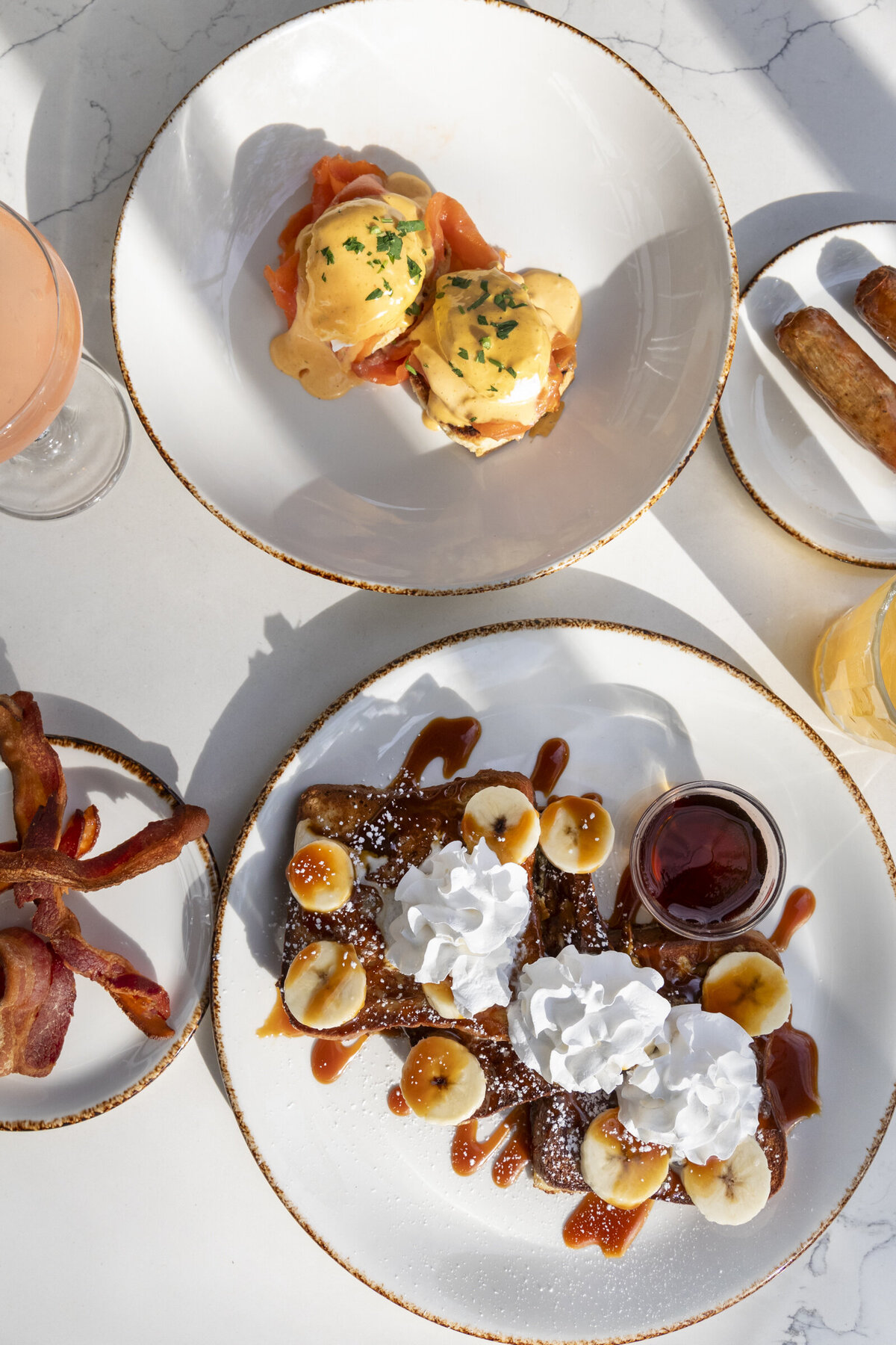 caramel crunch banana french toast and eggs benedict with a side of bacon from the Grant Park Bistro in downtown Chicago.