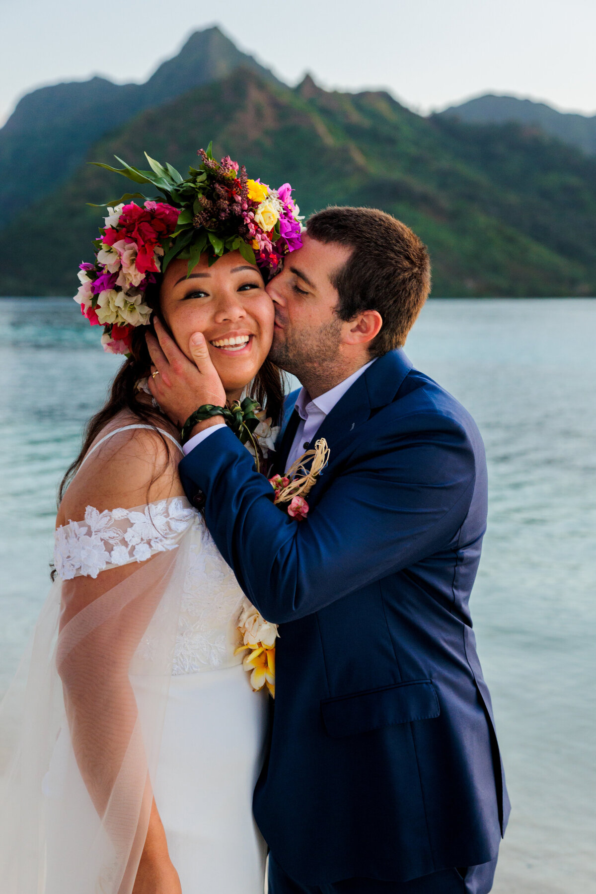 groom-kisses-bride-cheek-tahiti