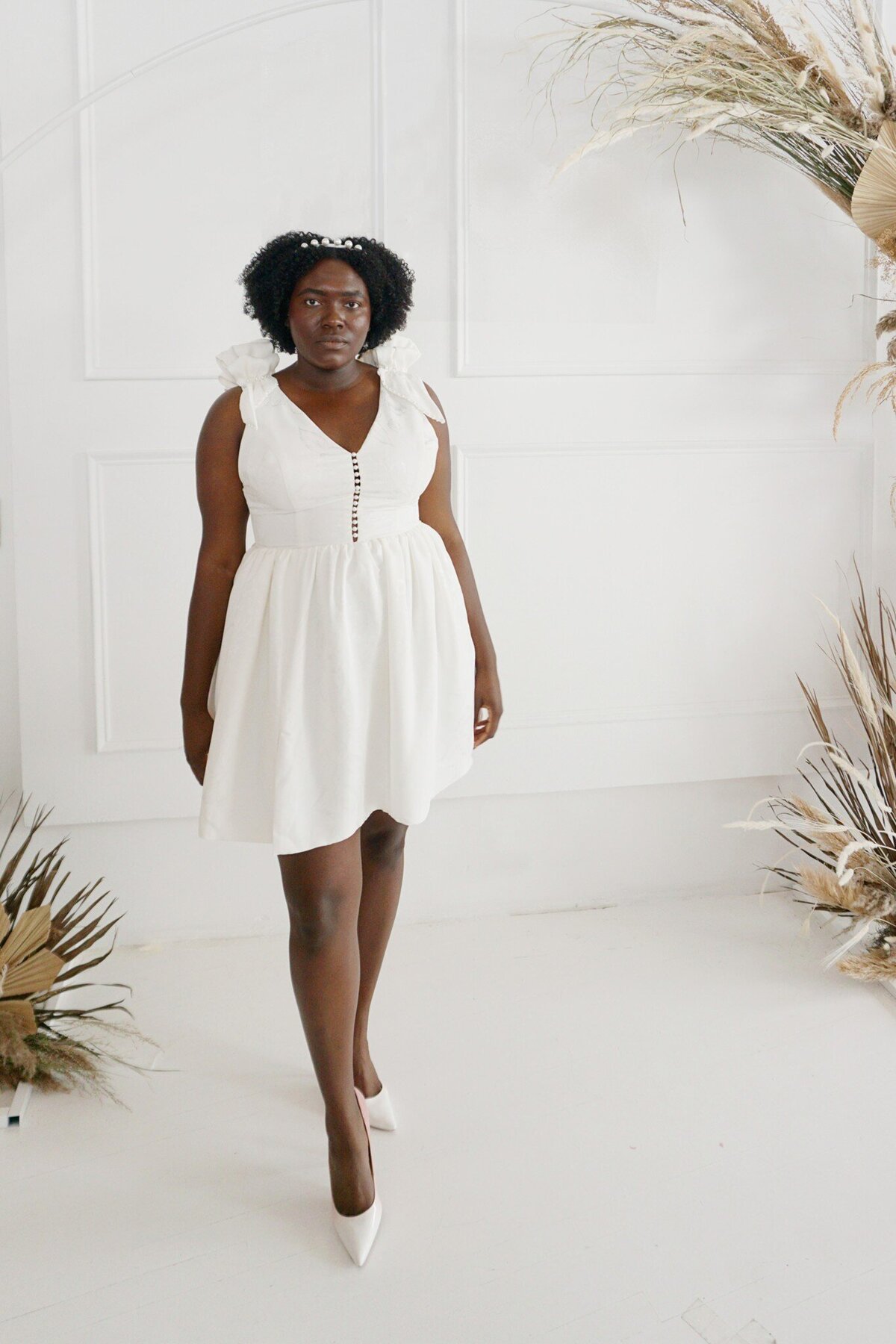 Curvy model in the Taylor short wedding dress style. The styles in the stock collections are all size-inclusive bridal styles.