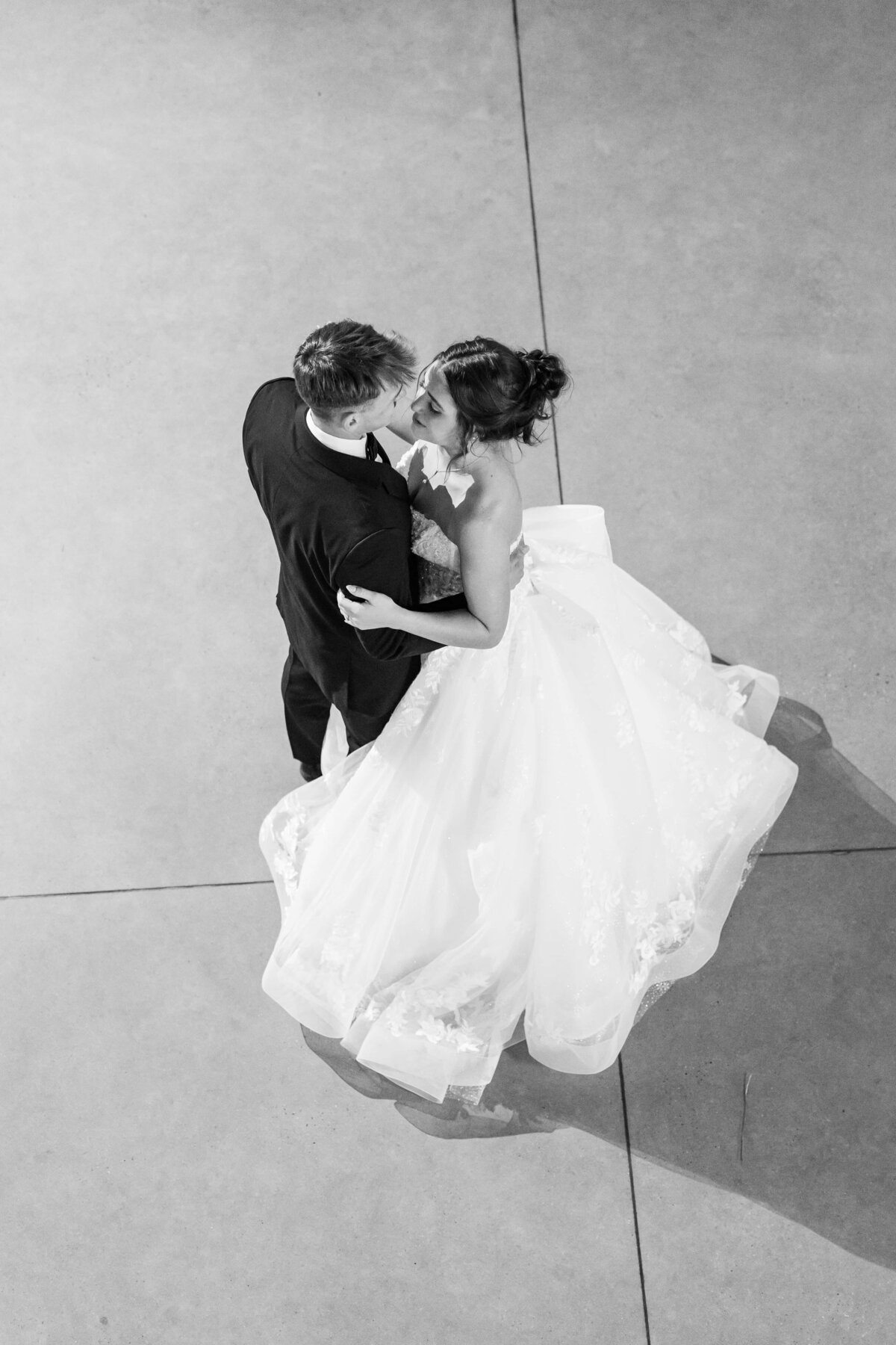 Couple spins on the dancefloor at Charlotte wedding
