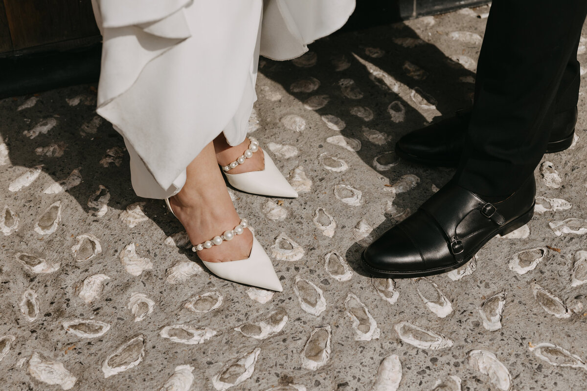 Detail shot of the bride and grooms footwear