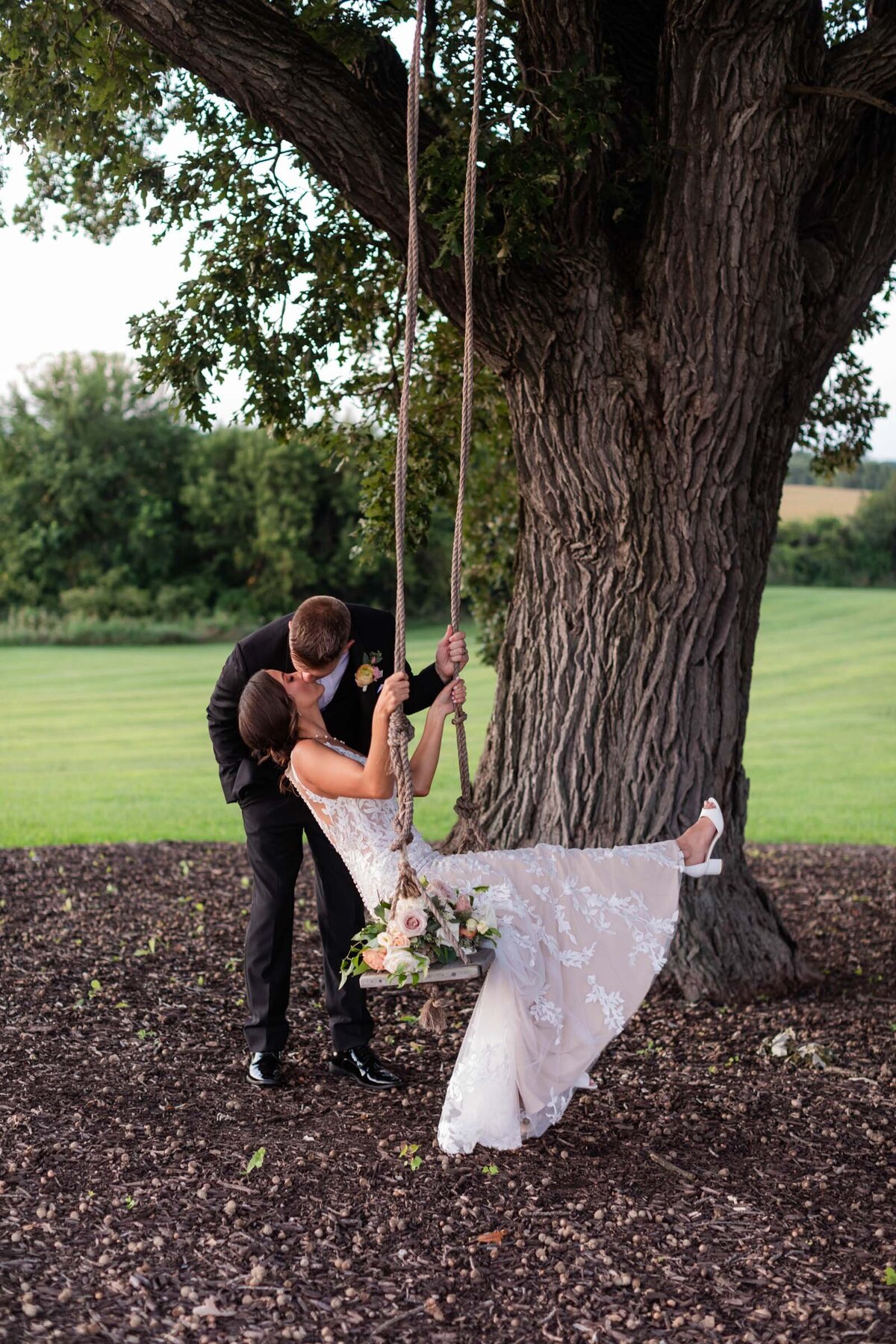 providence-vineyard-couple-kissing-on-the-swing