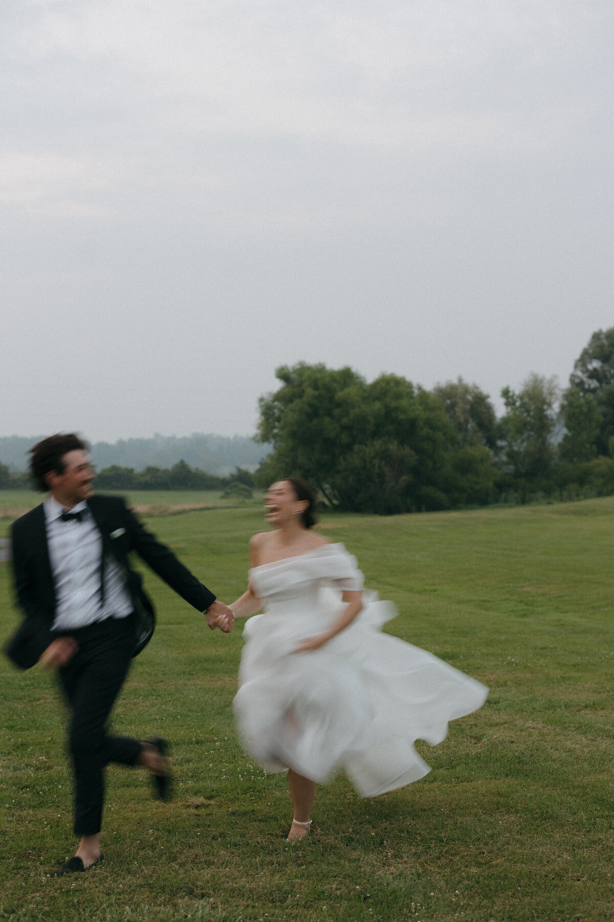 Elegant editorial wedding portrait showcasing fashion forward photography at Lion Rock Farm destination venue. Lauren Alatriste creates magazine-worthy imagery that balances high-end editorial composition with authentic celebration emotion in Connecticut's most sophisticated setting.