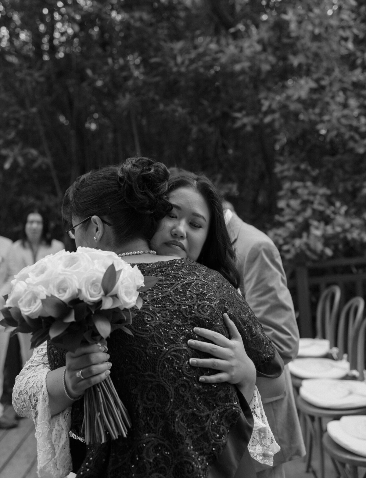 bride hugs mother at Mexico wedding ceremony, Paradisus Playa del Carmen