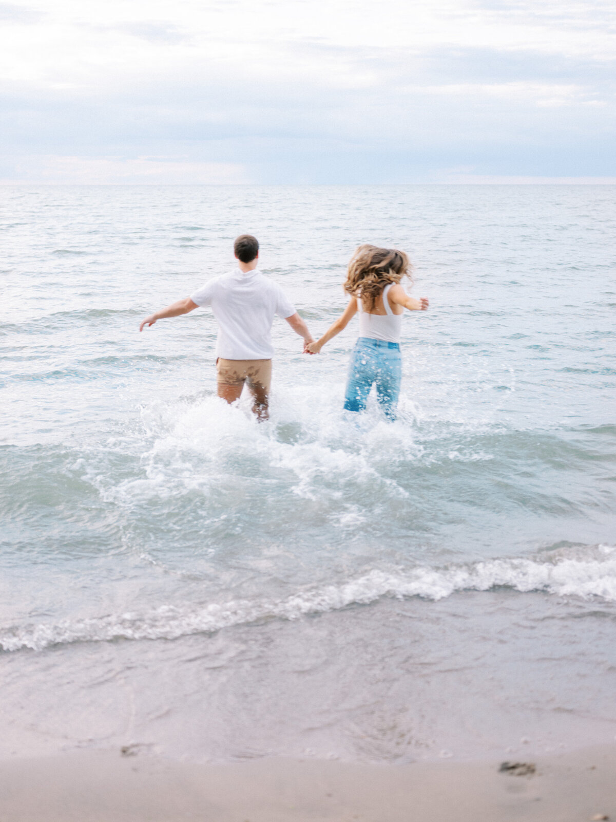 couple-running-into-lake-erie