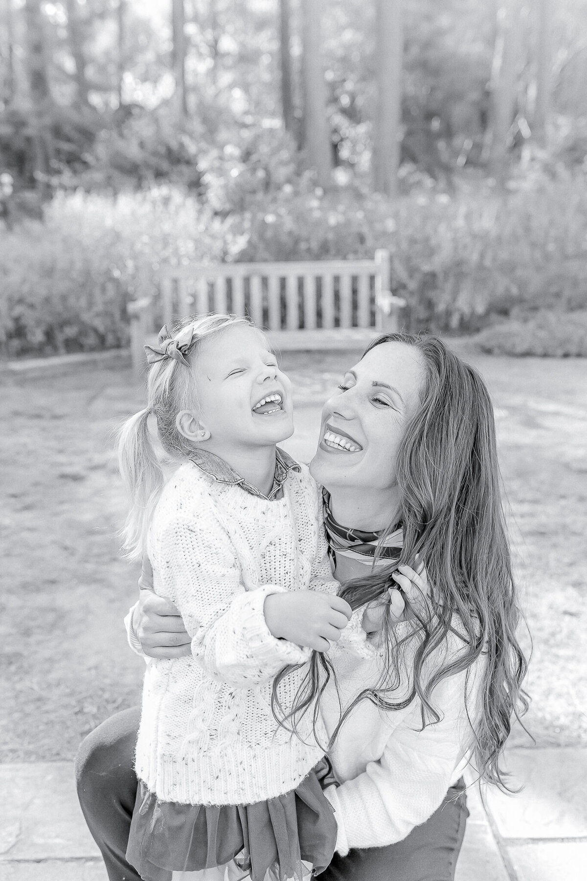 A mother and daughter share a plaayful moment