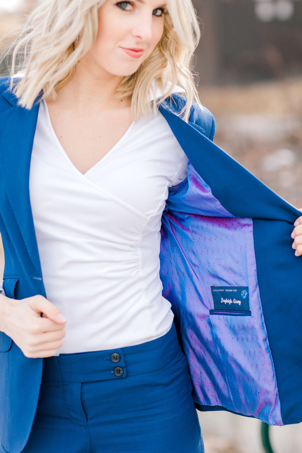 Female business owner wearing blue suit