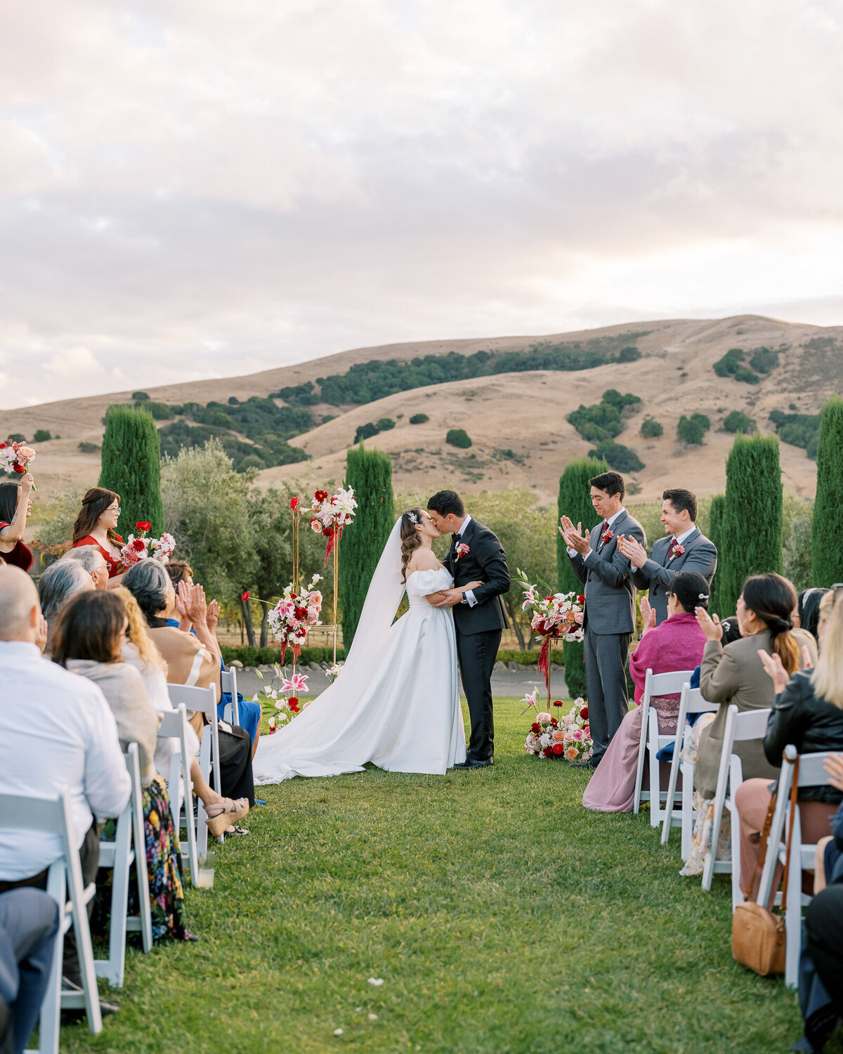 First kiss at vineyard wedding