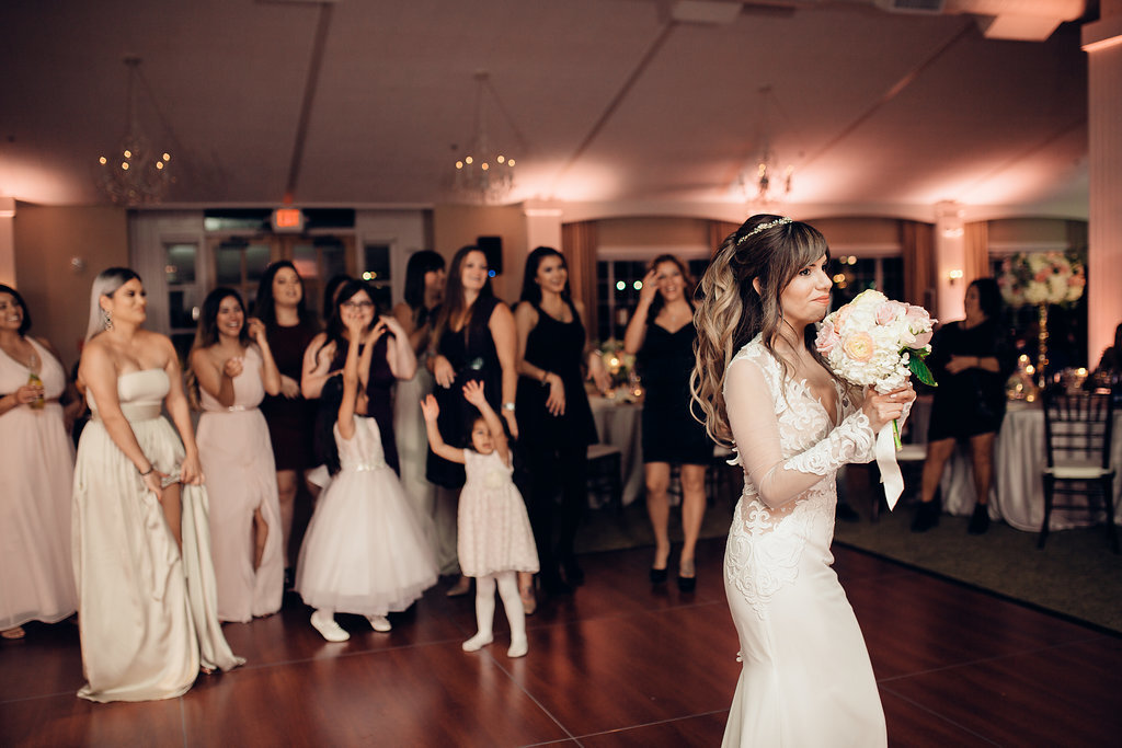 Wedding Photograph Of Bride Raising The Wedding Bouquet Los Angeles