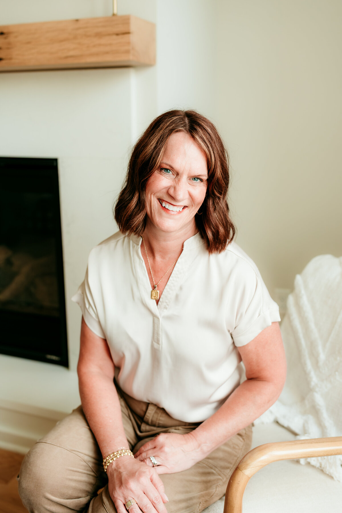 Editorial-style headshot for a creative professional, showcasing modern lighting and clean background.