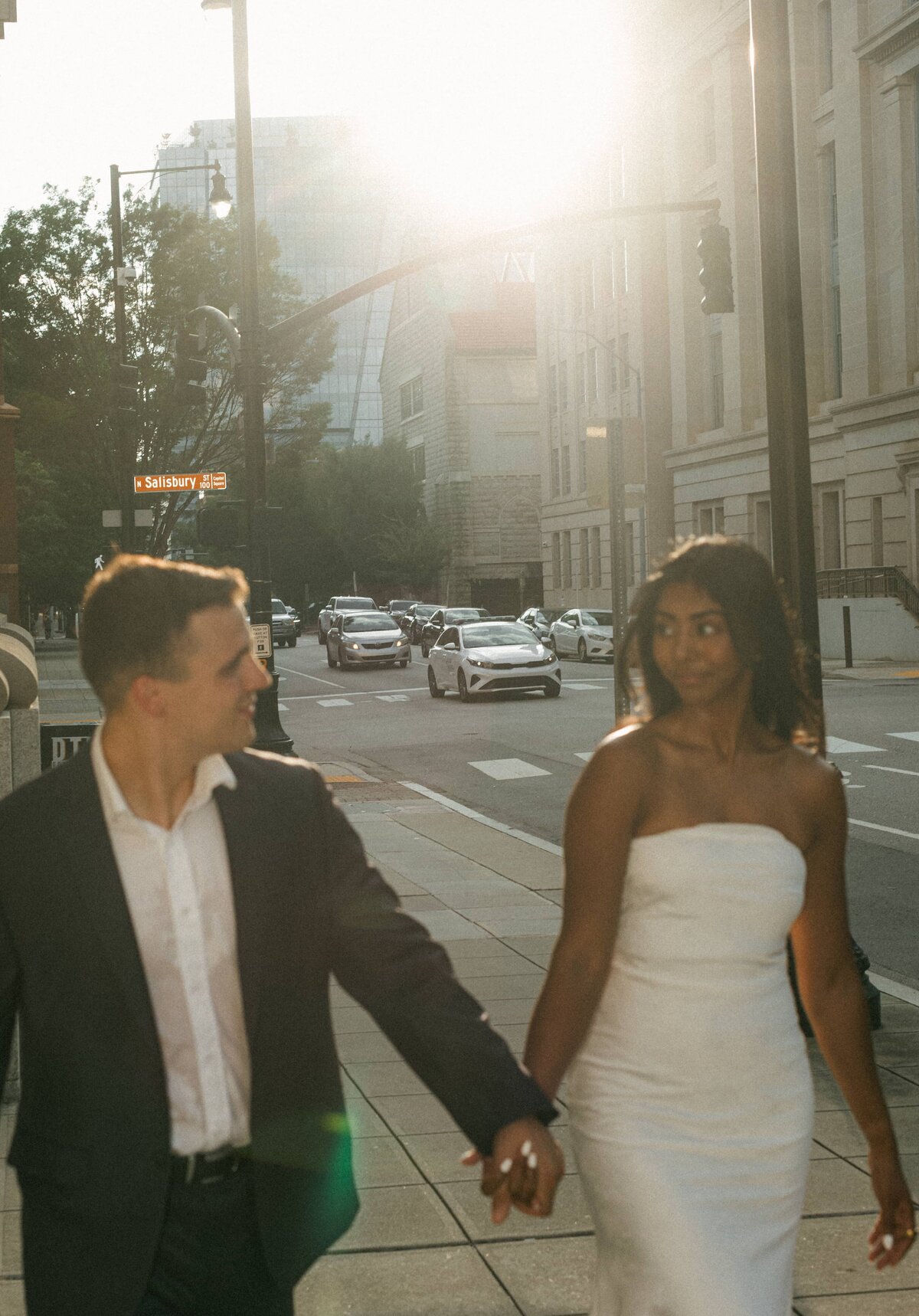 Candid couples photography in Williamsburg, Brooklyn with city skyline.
