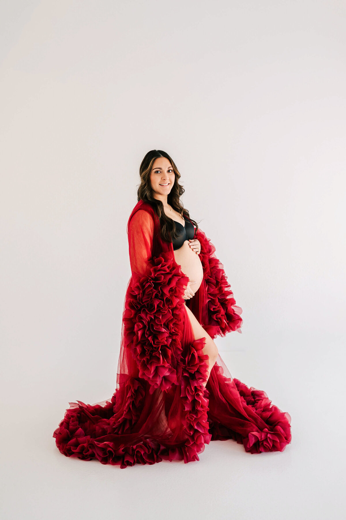 side profile of pregnant mom in red dress captured by Springfield MO maternity photographer Jessica Kennedy of The XO Photography