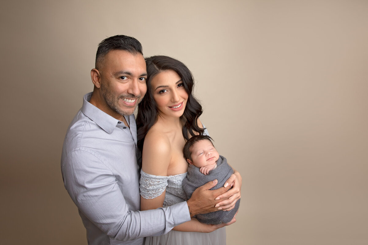 A heartwarming first family portrait celebrating the arrival of your little one. Shot in our Phoenix studio, where we specialize in creating memories that last a lifetime.