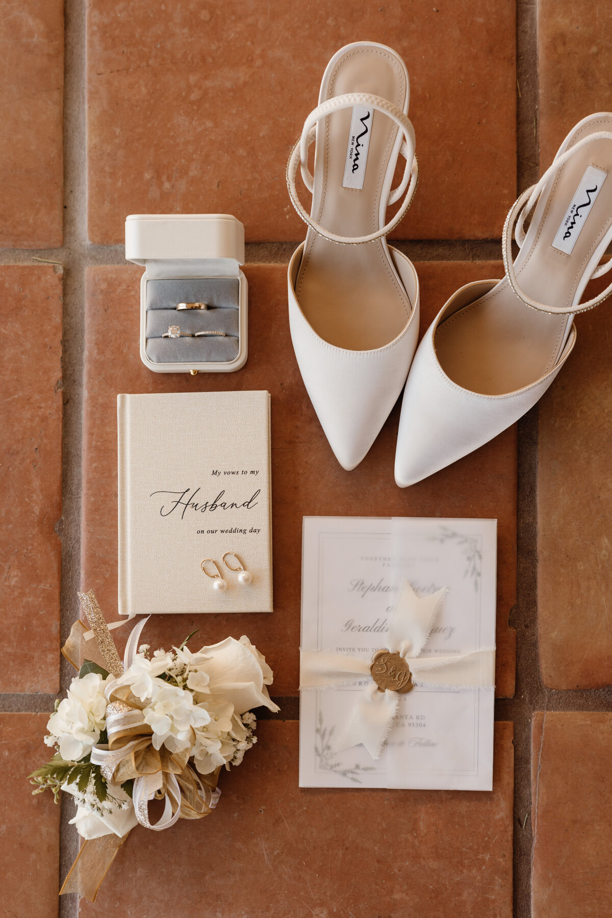 wedding invitation, earrings, shoes, vow book