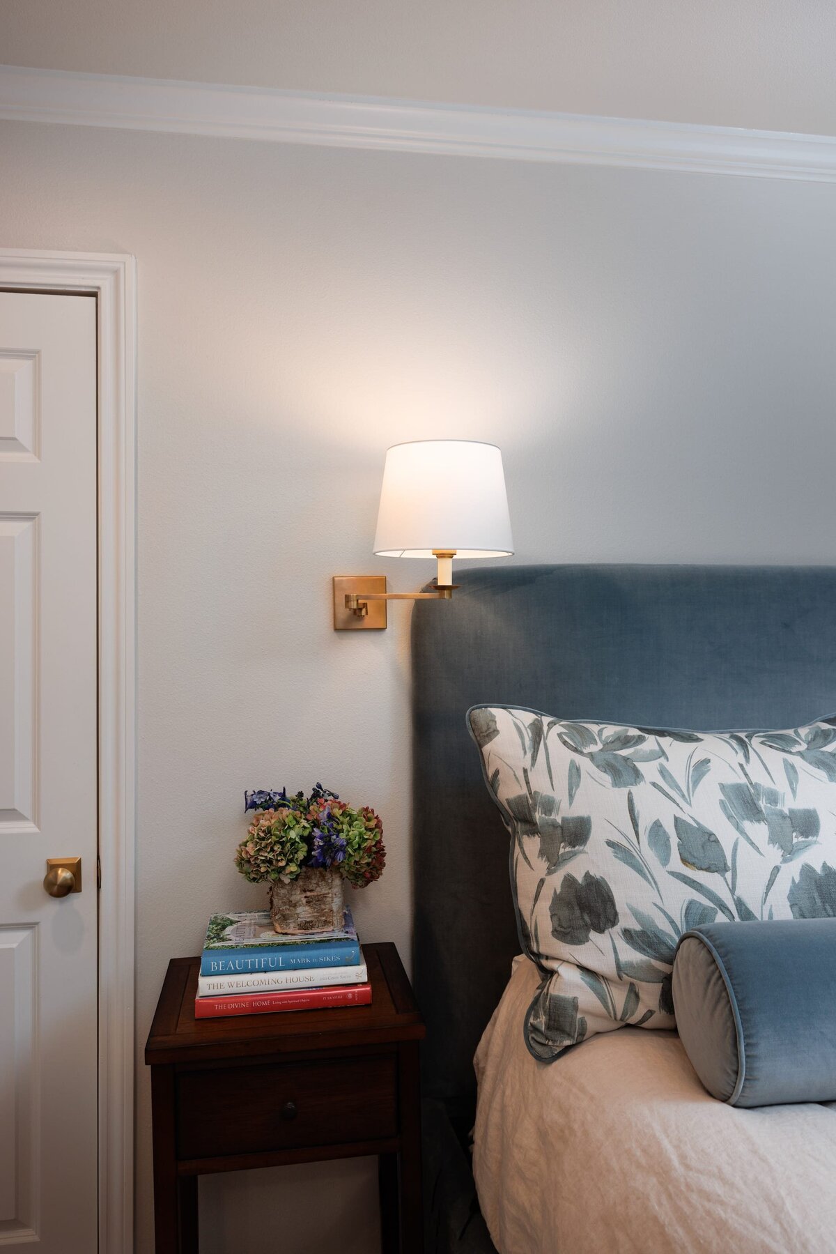 the keeping room interiors oakview bedroom with small wooden table and lamp