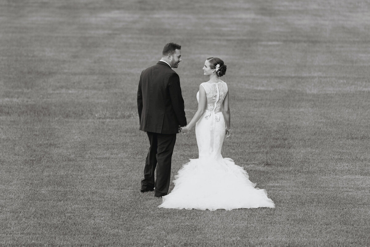 bride and groom walking the lawn at de Seversky Mansion