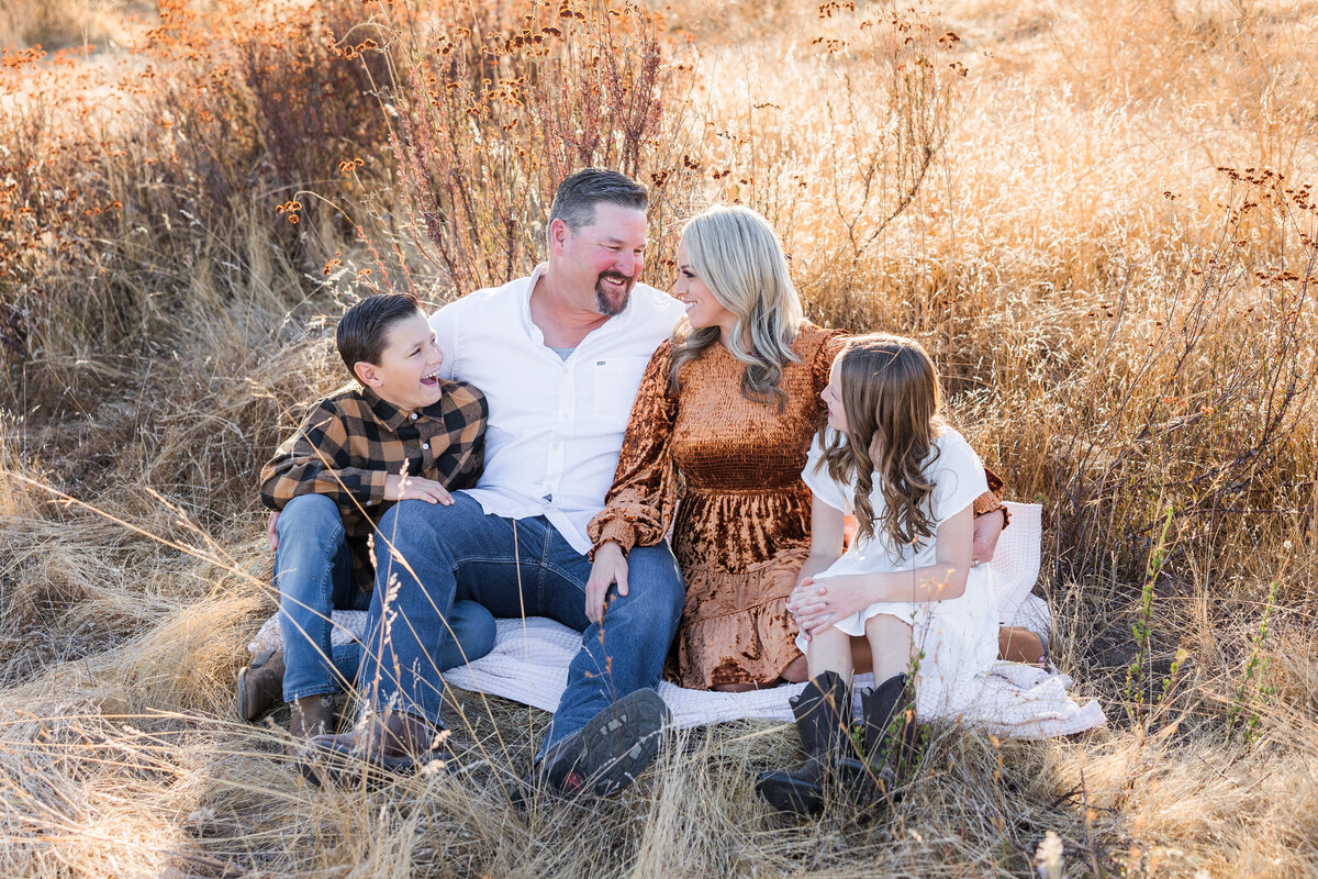 family sitting in wrights field san diego