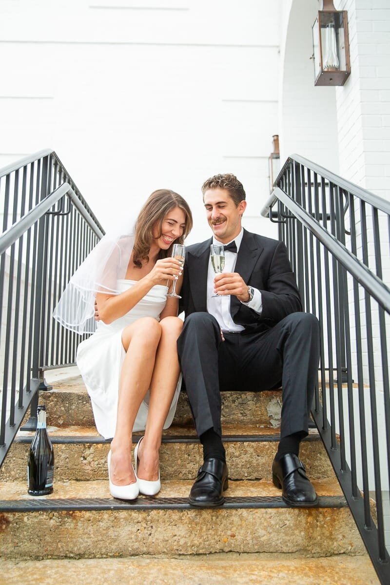bride-groom-champagne-stairs-pinehurst