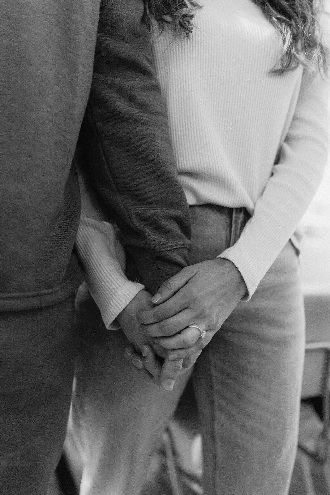 Close up of couple holding hands at Finger Lakes engagement session