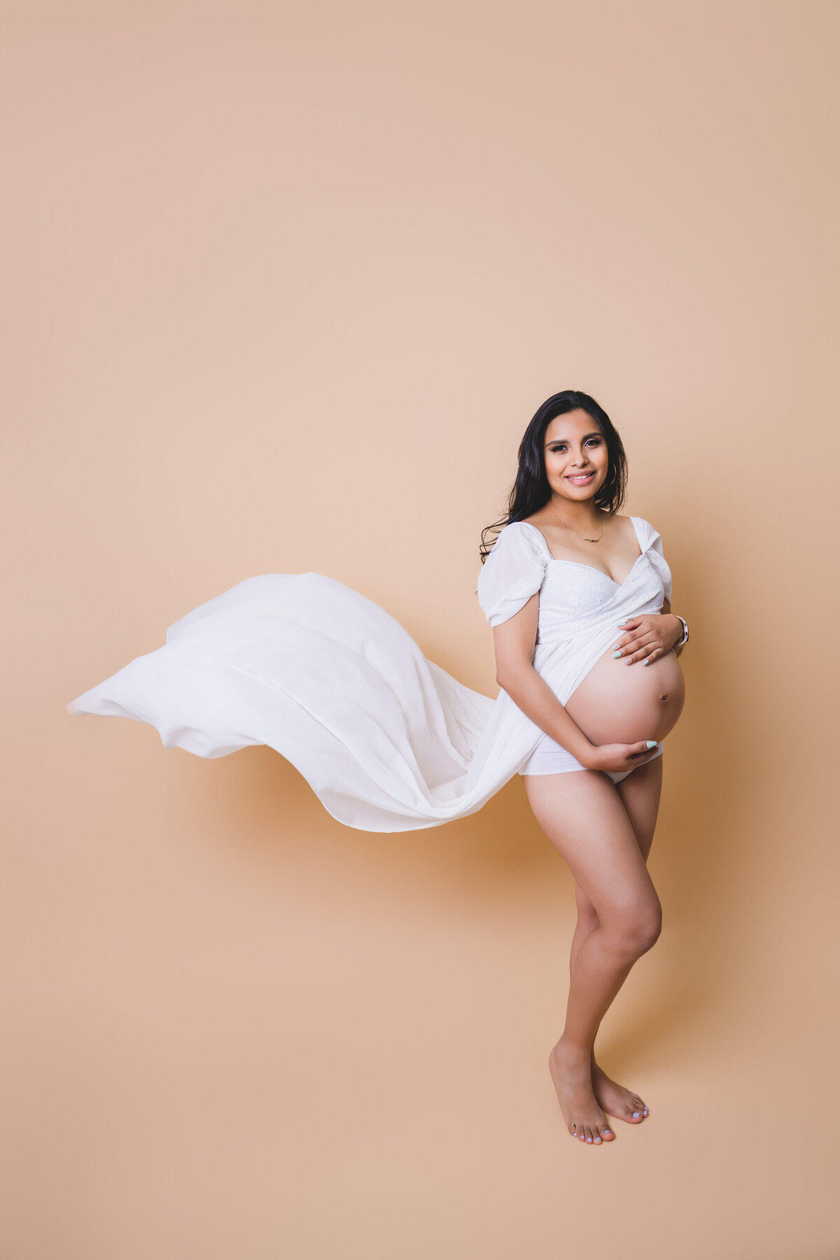 Expecting mother in designer gown — fine art maternity photography in Marin County