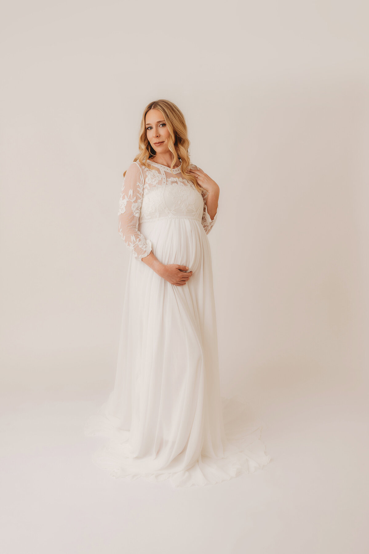 Expectant mother poses for her Maternity Pictures in Charleston, SC Maternity Photography Studio. 
