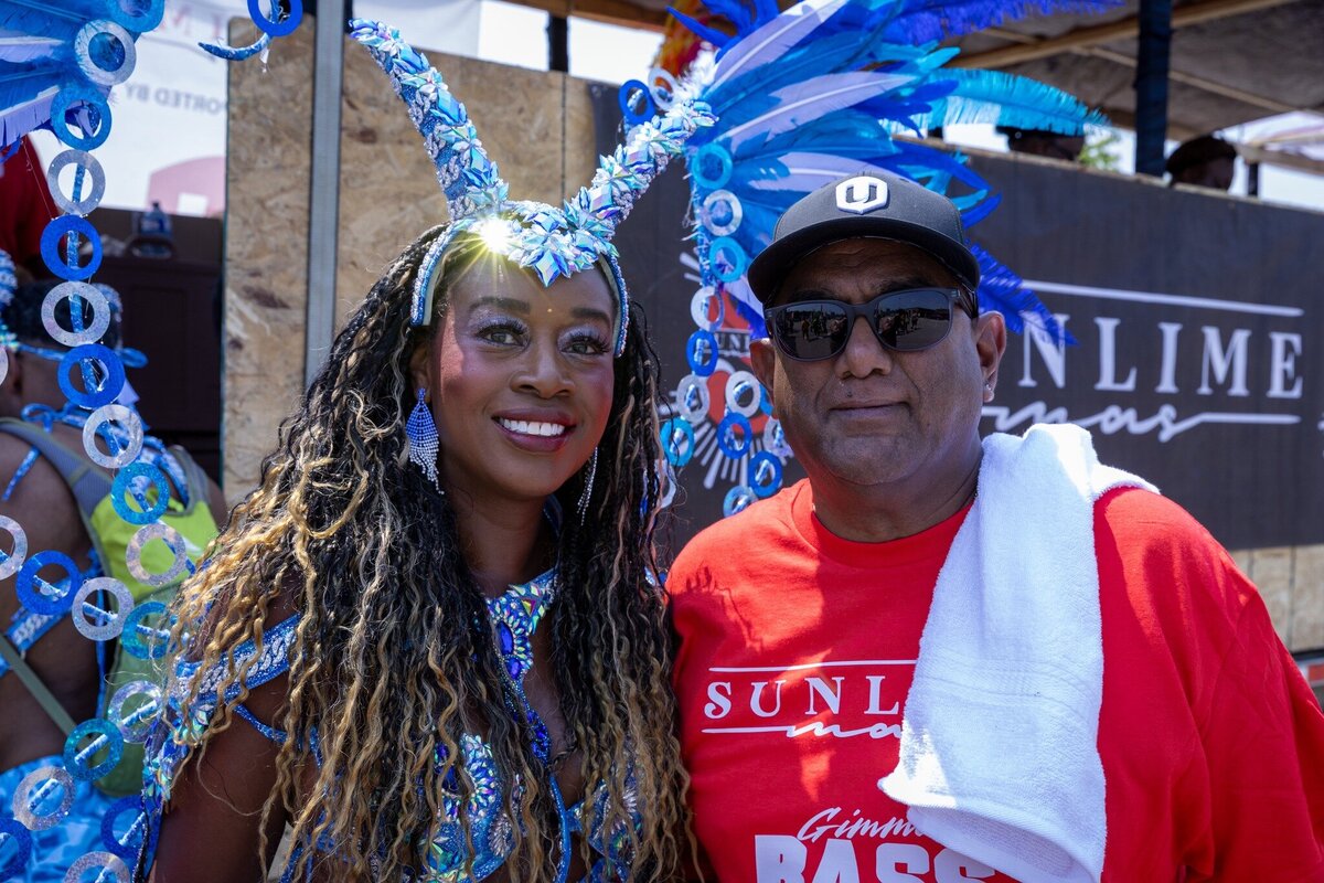 Toronto caribbean carnival parade masqueraders having fun in costume with Sunlime Mas, the number 1 medium size band at Toronto Carnival.