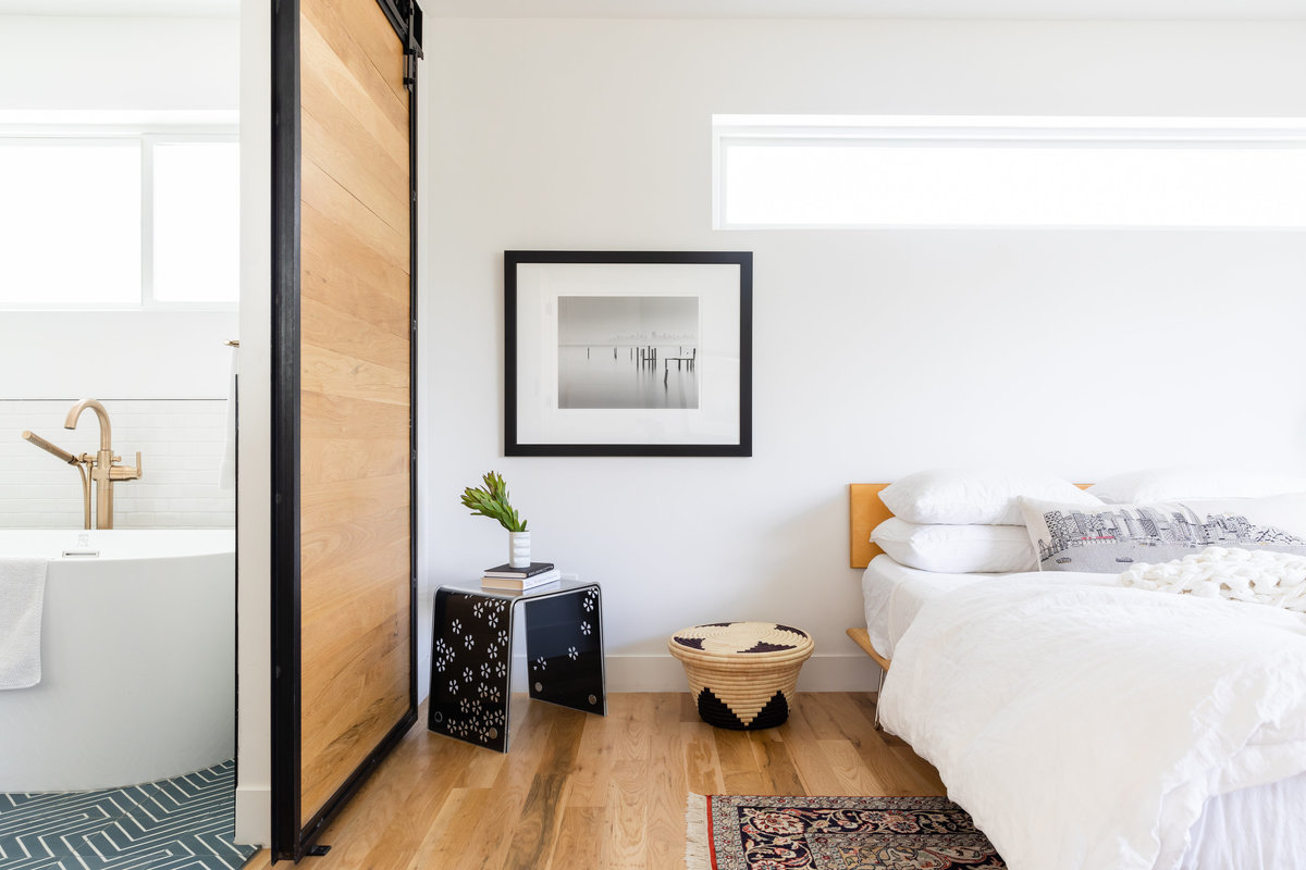 Light filled modern master bedroom design by Denver based interior designer Fernway & Avalon