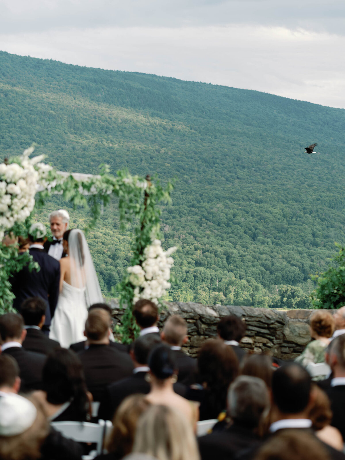 bald eagle flys by ceremony at  hildene wedding in manchster, vt ceremony